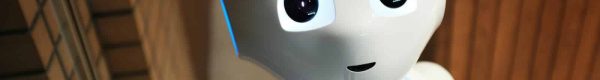 white robot near brown wall