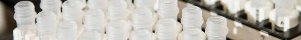 shallow focus photography of white bottle lot