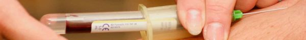 person injecting syringe